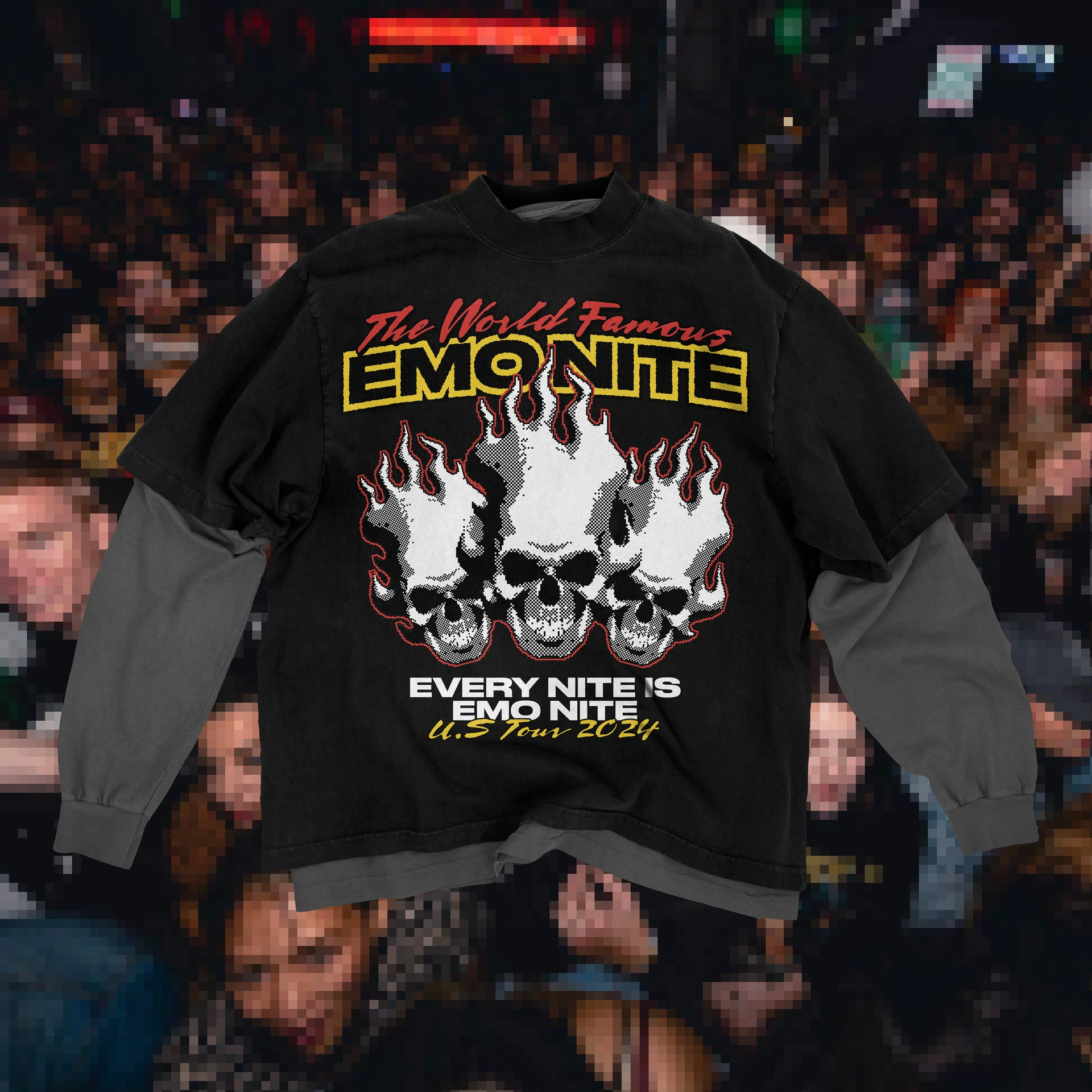 Emo Nite illustrated black hoodie held above the audience at a live event