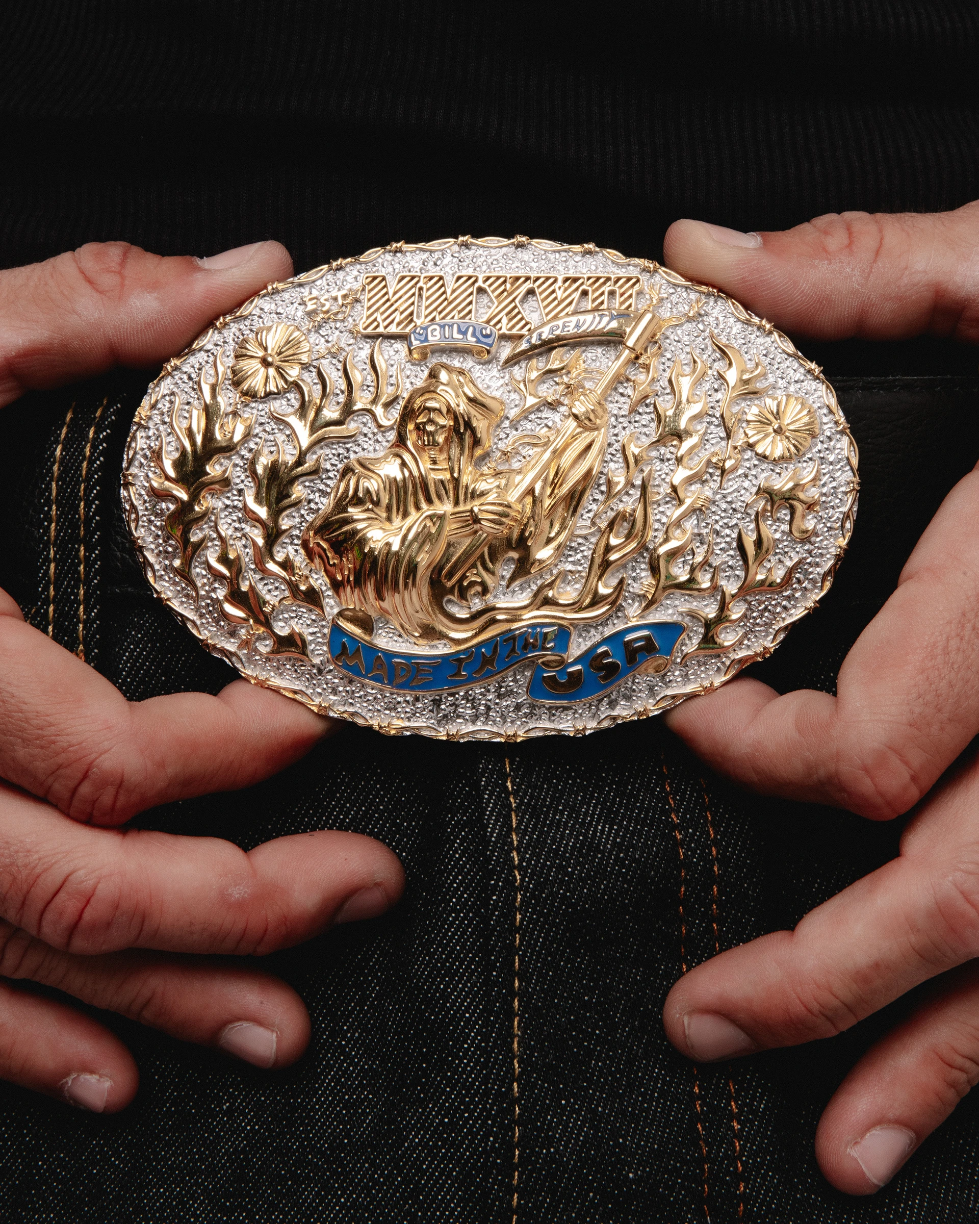 Warren Lotas belt buckle photographed in the model's hands